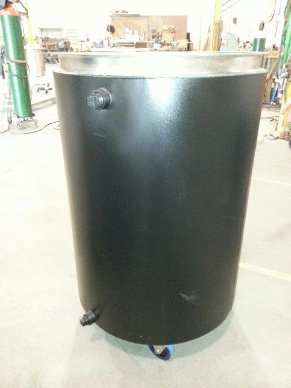 Stainless portable tank with carbon steel jacket